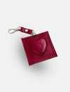 Red heart-shaped bag charm