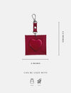 Red heart-shaped bag charm